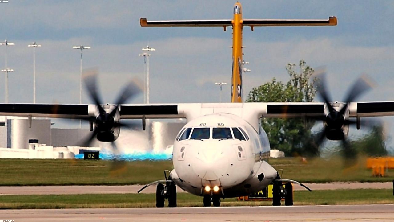A light propeller aircraft at an airfield